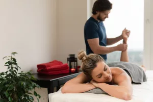 Woman during foot massage in professional massage parlor