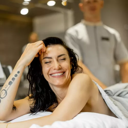 Woman receiving vacuum roller massage at beauty salon